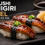 Glazed unagi sushi nigiri eel served on seasoned rice at a Japanese restaurant.